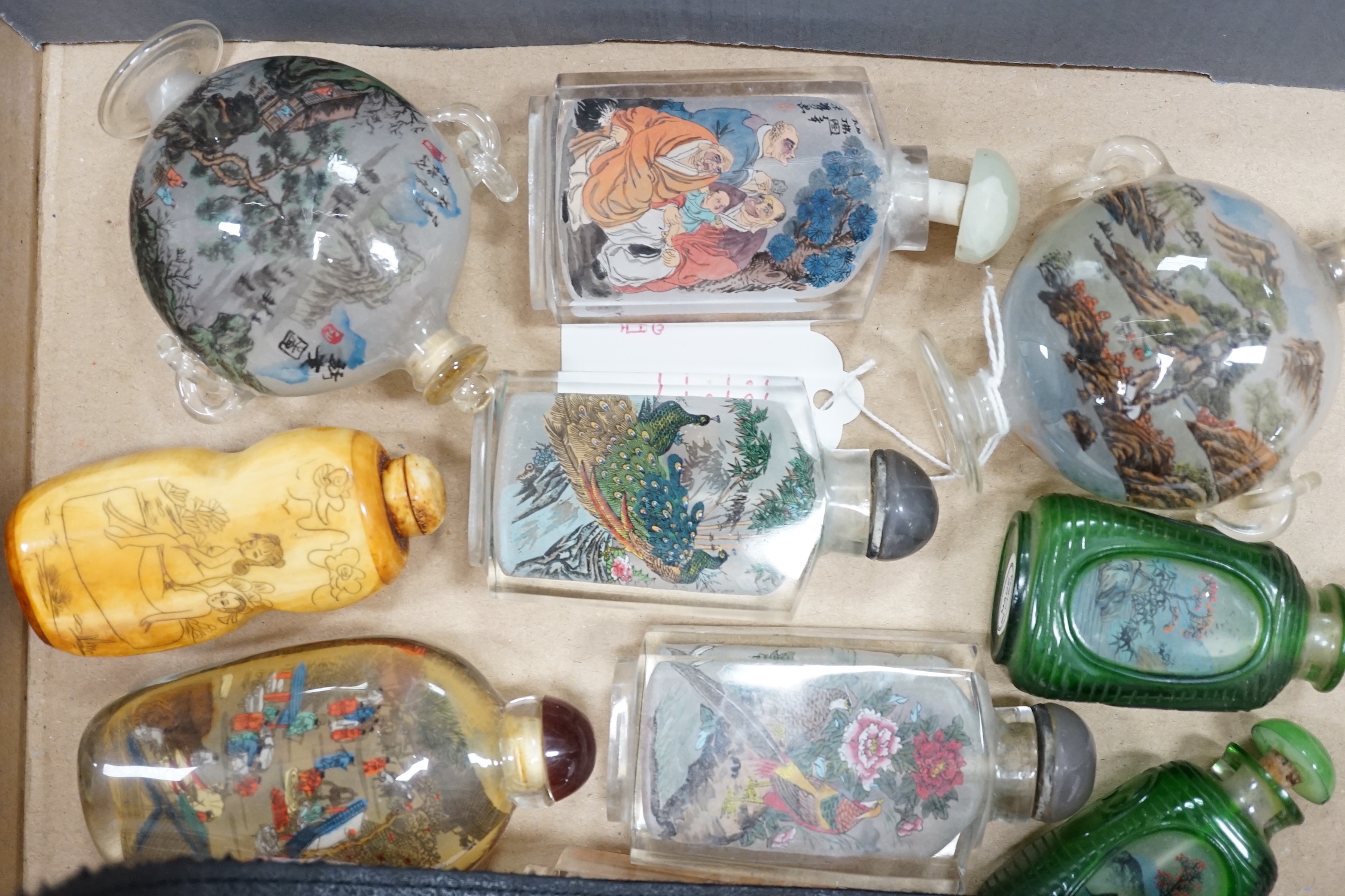 A collection of Chinese snuff bottles, mostly reverse painted (2 trays)